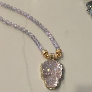 Elegant Gold and Purple Skull Pendant Necklace